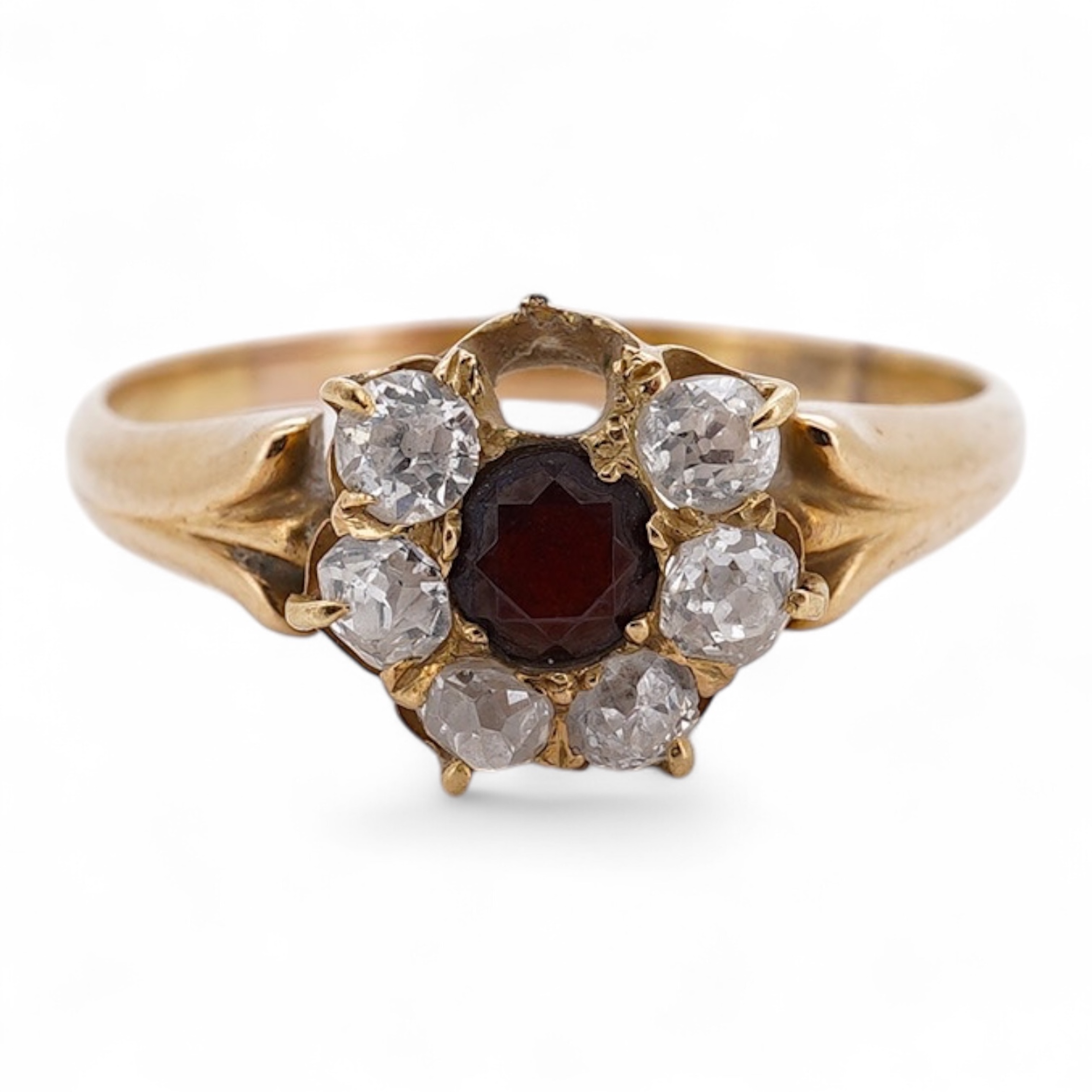 A yellow metal, garnet? and diamond set circular cluster ring (one stone missing), size P, gross weight 3 grams. Condition - poor